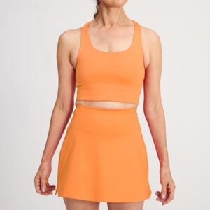 Girlfriend Collective Orange Sport Skirt and Orange Racerback Sport Tank Top Set